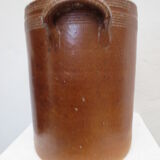 Old butter jug in flaming sandies