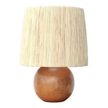 Wooden ball lamp with a raffia shade from the 1970s.