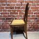 Set of a chair and an armchair in wood and yellow fabric
