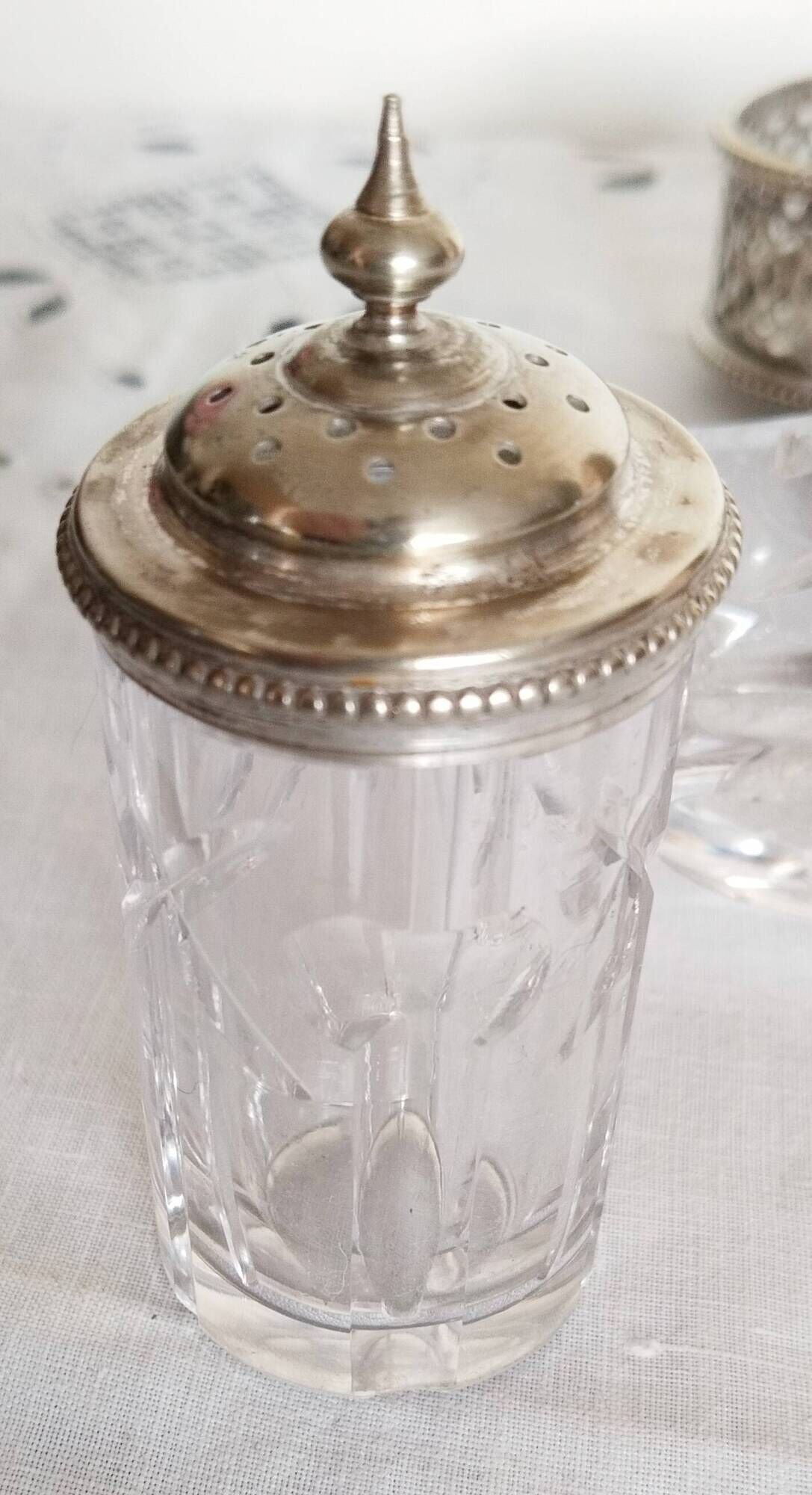 Salt, pepper and mustard shaker set in chiseled glass and silver metal