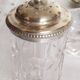 Salt, pepper and mustard shaker set in chiseled glass and silver metal