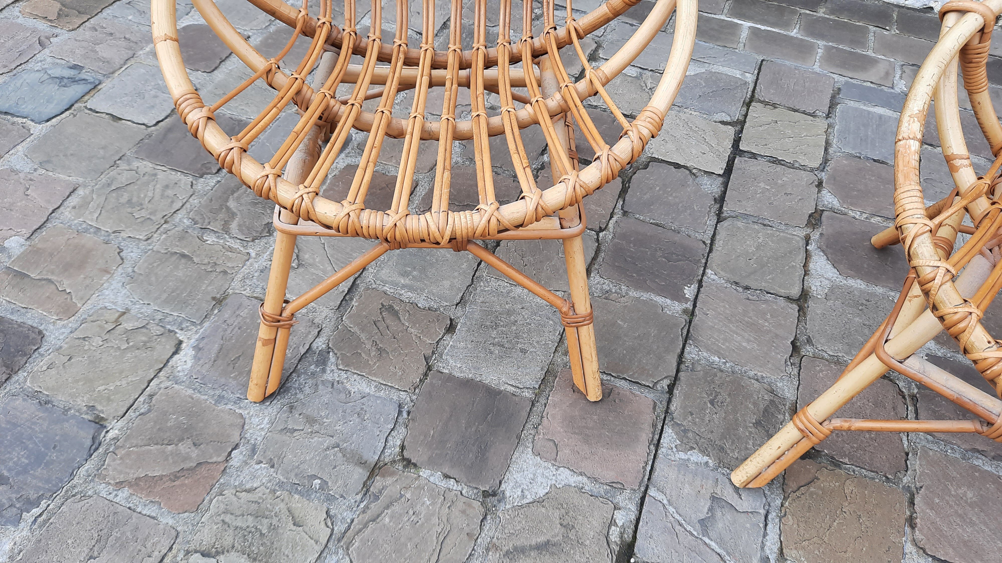 Pairs of shell rattan armchairs from the 50