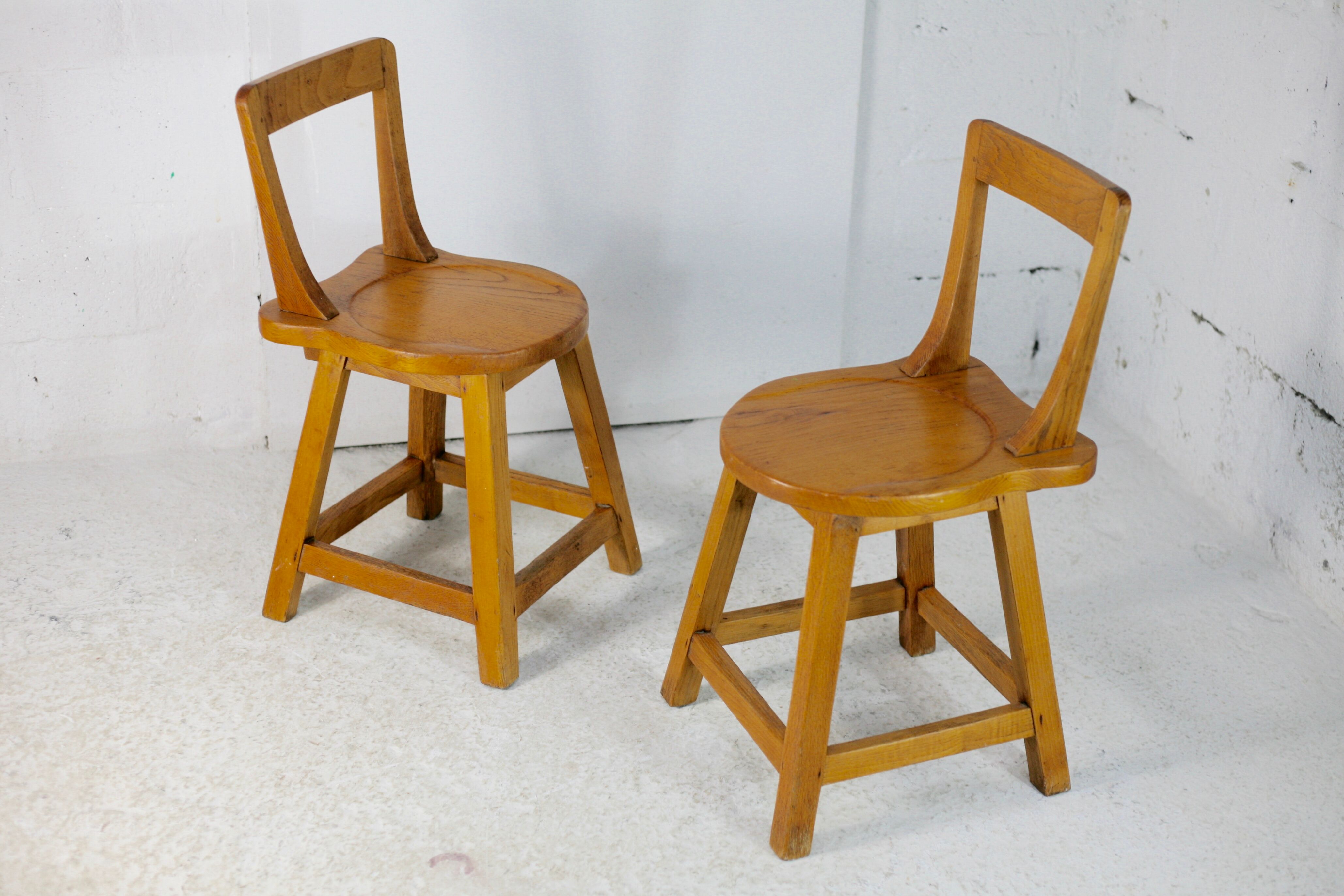 Pair of brutalist wooden back stools. France, circa 1960