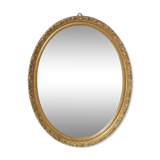 Beveled oval mirror and gilded wood frame