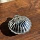 Vintage silver-plated shell butter dish with blue bowl.
