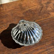 Vintage silver-plated shell butter dish with blue bowl.