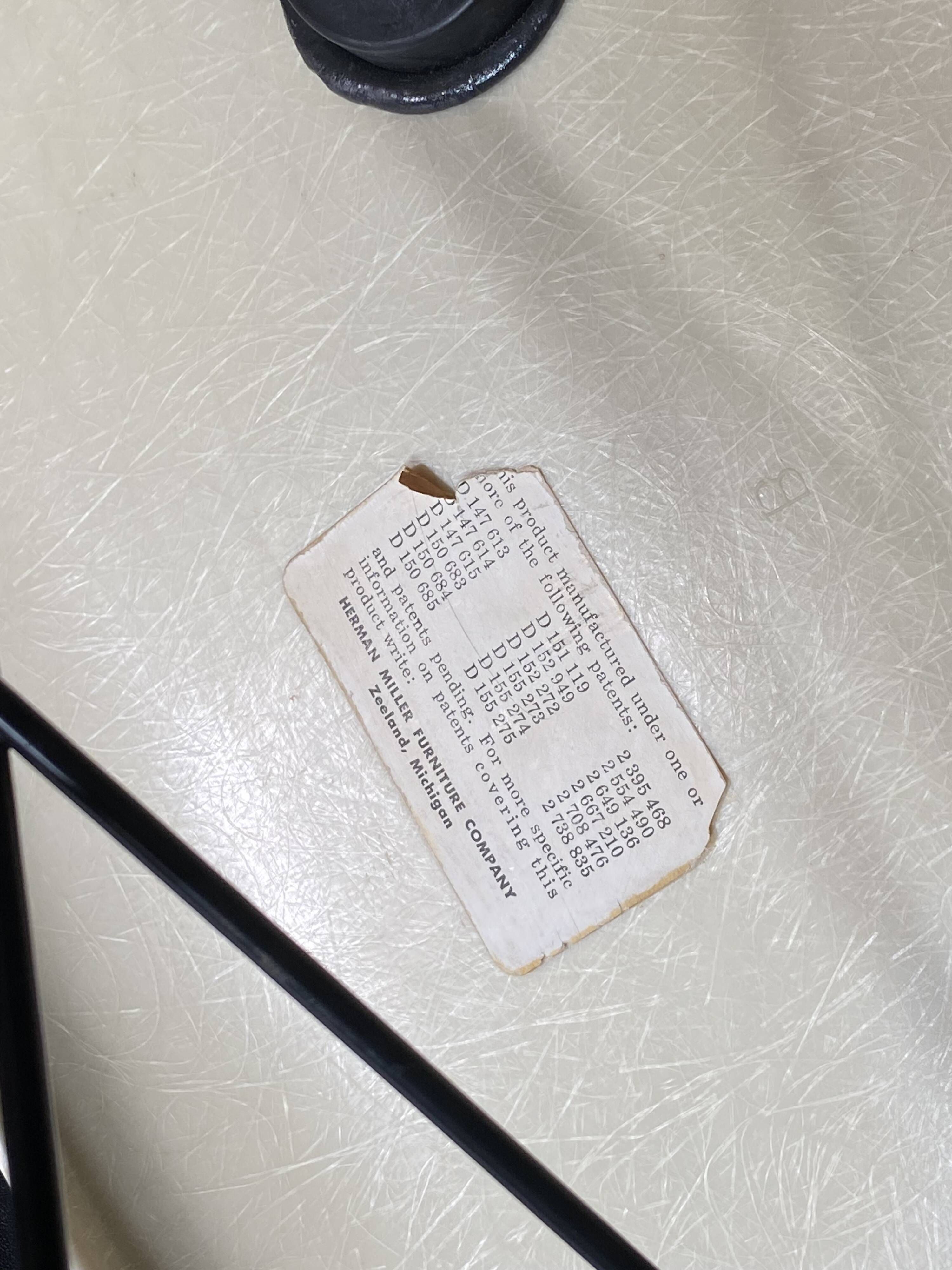 Eames lounge chair white fibre parchment base cat’s cradle Herman Miller