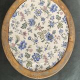 Oval mirror in gilded wood.