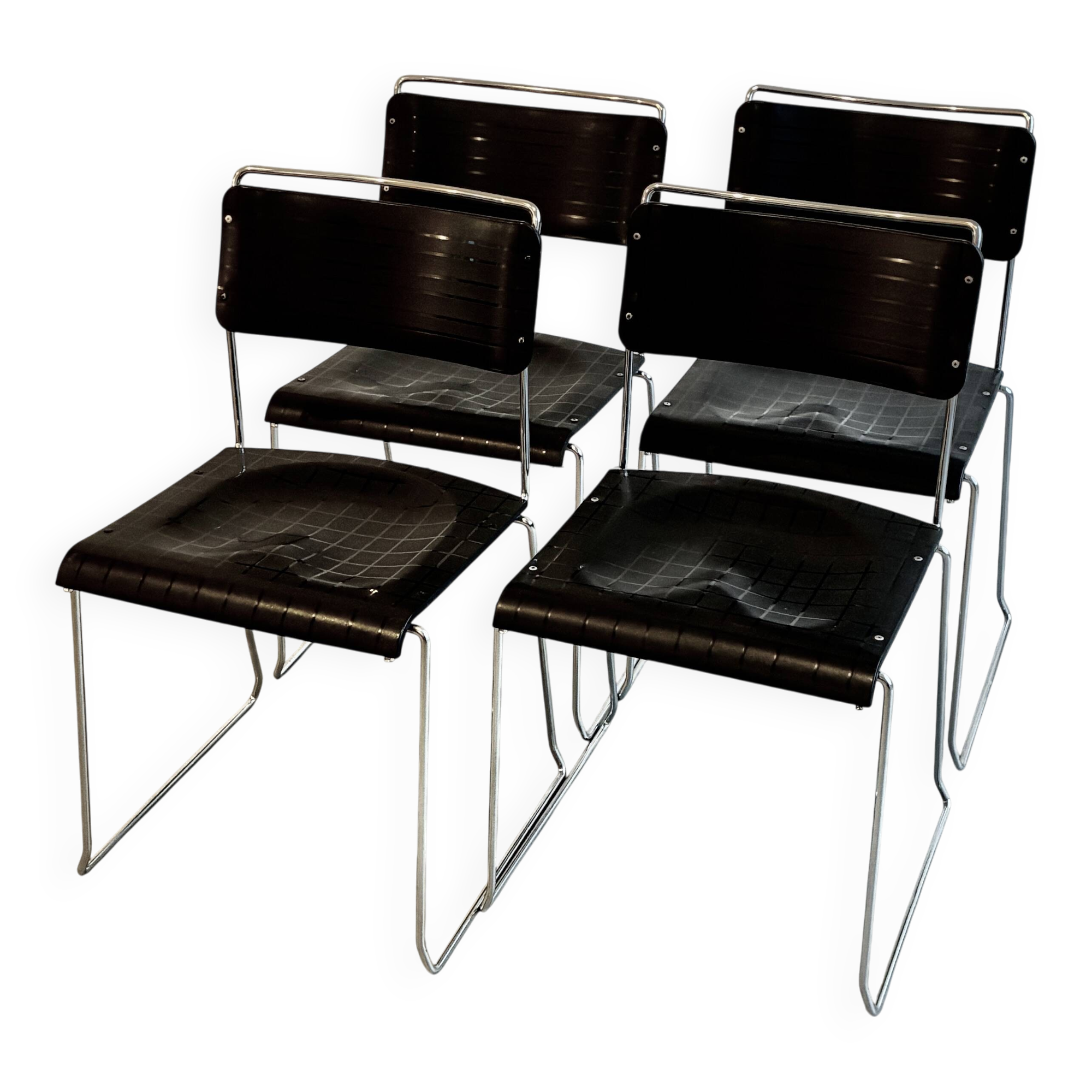 4 Spilimbergo chairs from Italy in chrome steel and black plastic.
