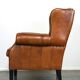 Très beau fauteuil à oreilles en cuir de mouton avec des détails époustouflants