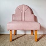 Single bar stool in pink stitched faux leather.