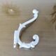 Pair of Art Deco white cast iron coat hooks from the 1930s and 1940s