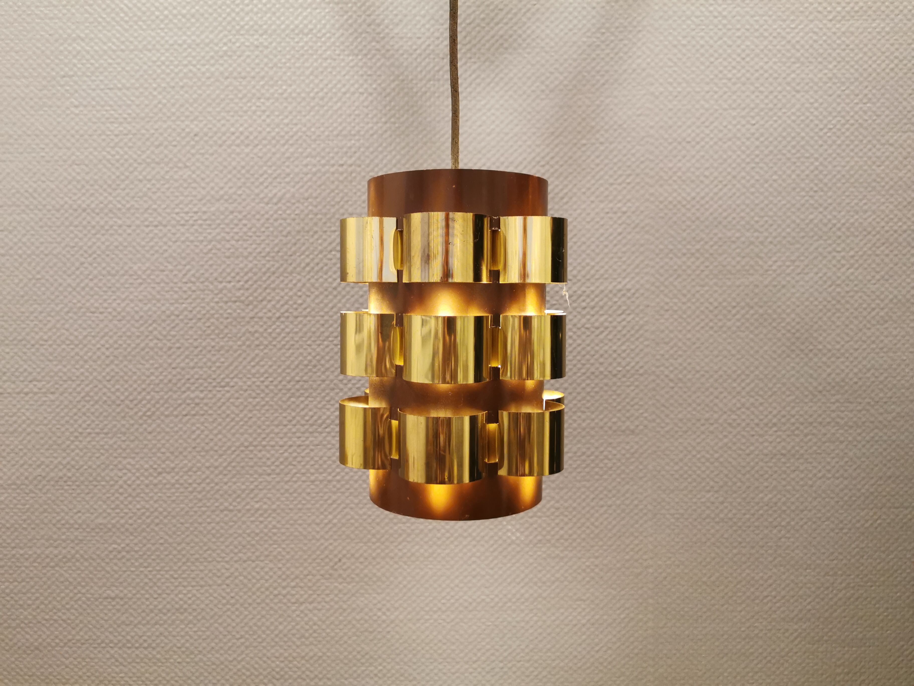 Danish hanging lamp from the 70s, in thin cut metal.