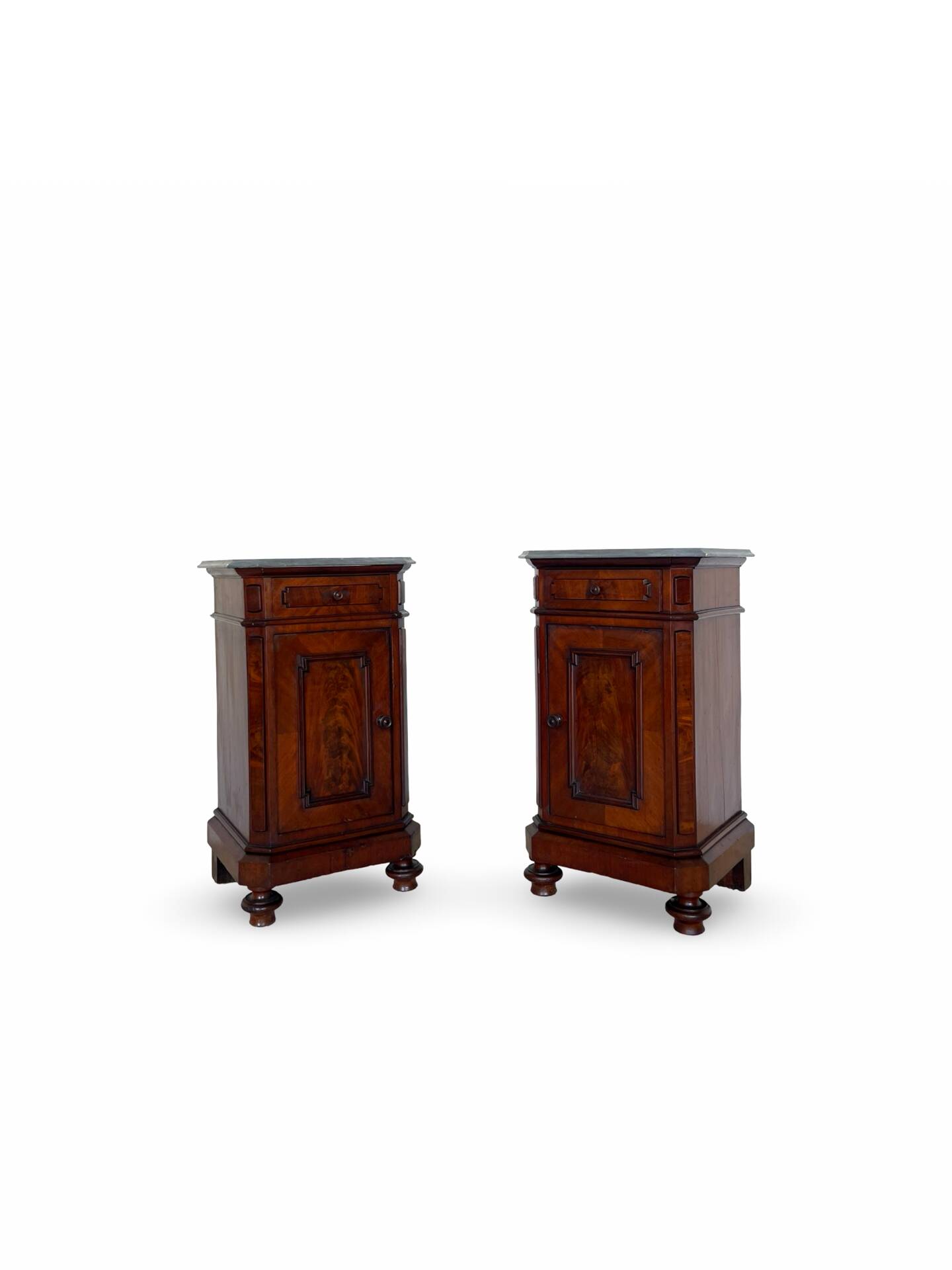 A pair of antique walnut bedside tables from the 1890s.