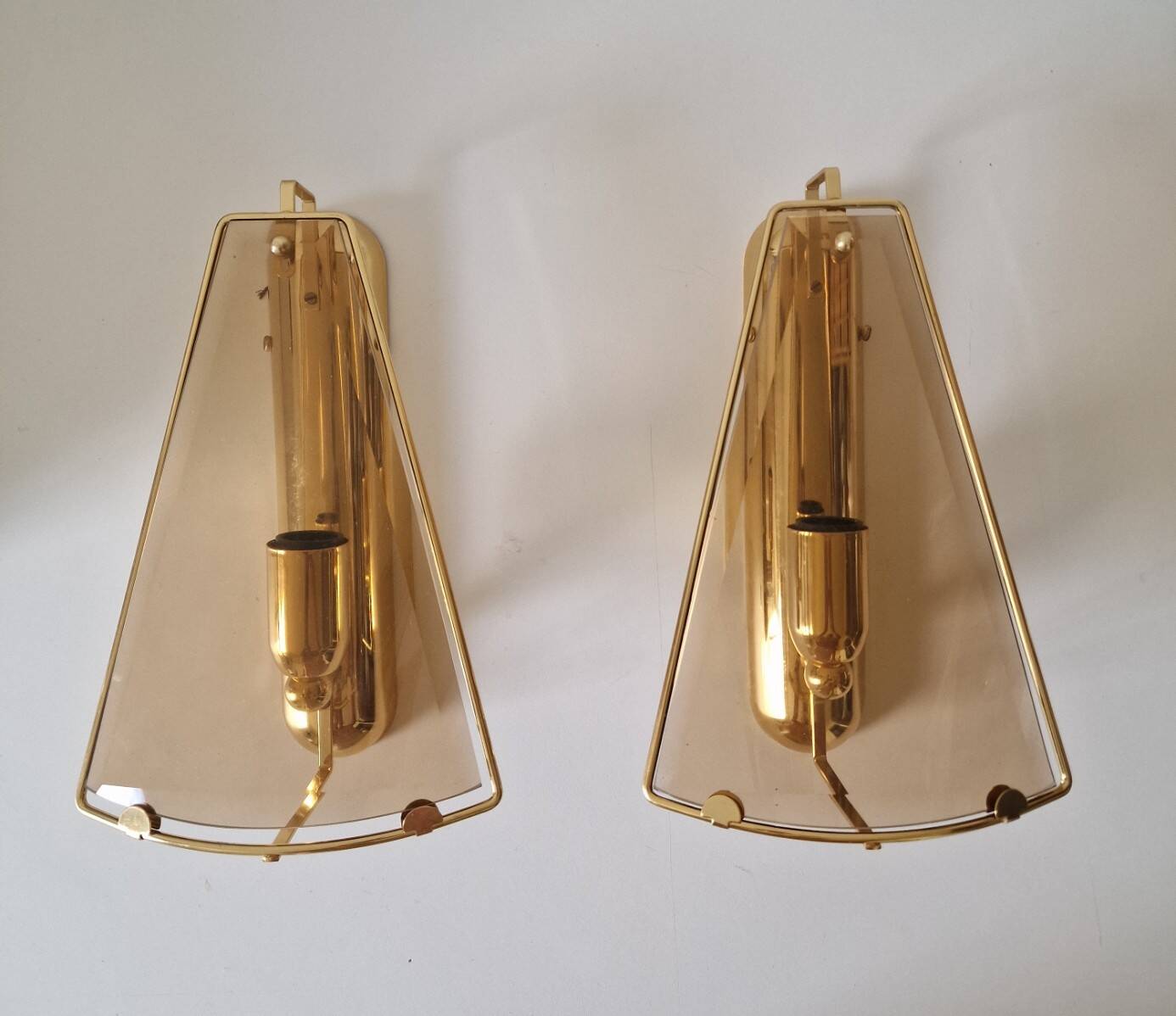 Pair of wall lights in brass and smoked glass by Lakro Amstelveen.