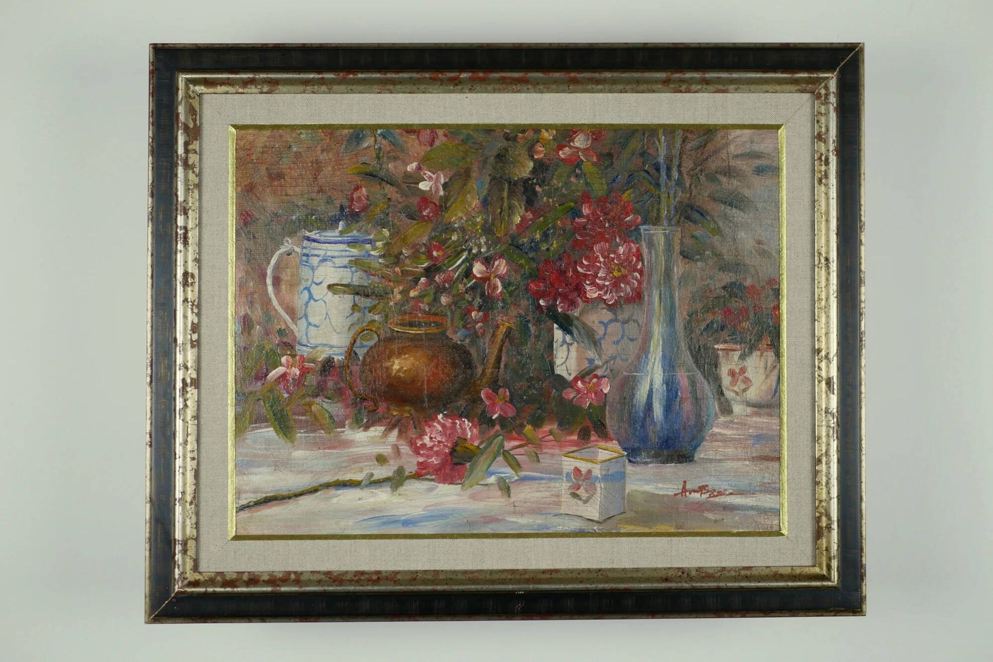 Still life with pink flowers and blue pots.