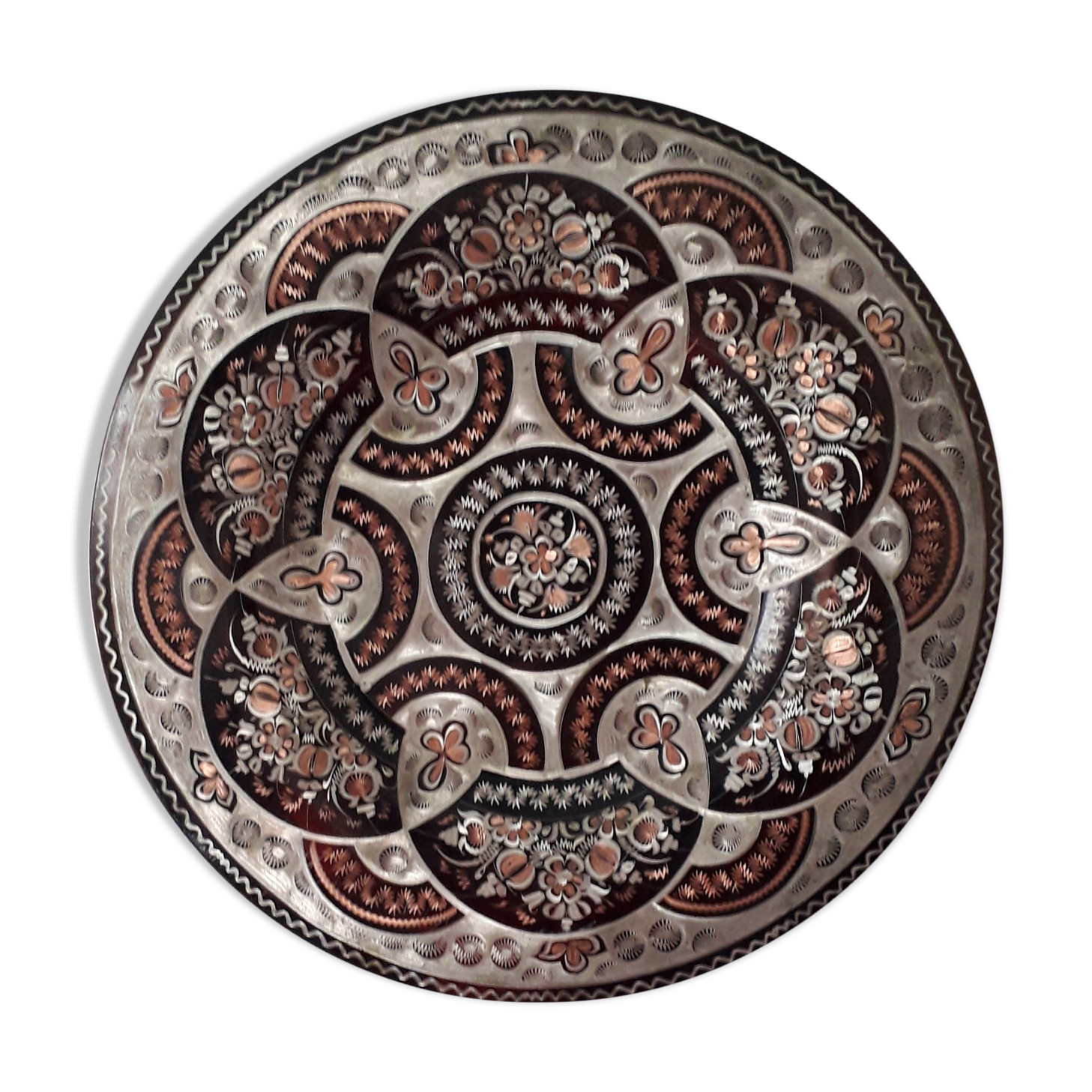 Oriental dish in chiseled red copper