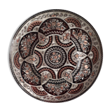 Oriental dish in chiseled red copper