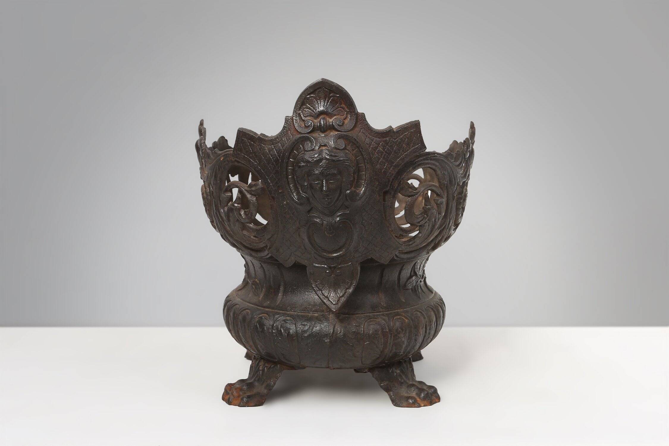 Cast Iron planter decorated with masks and lion paws, France 1850s