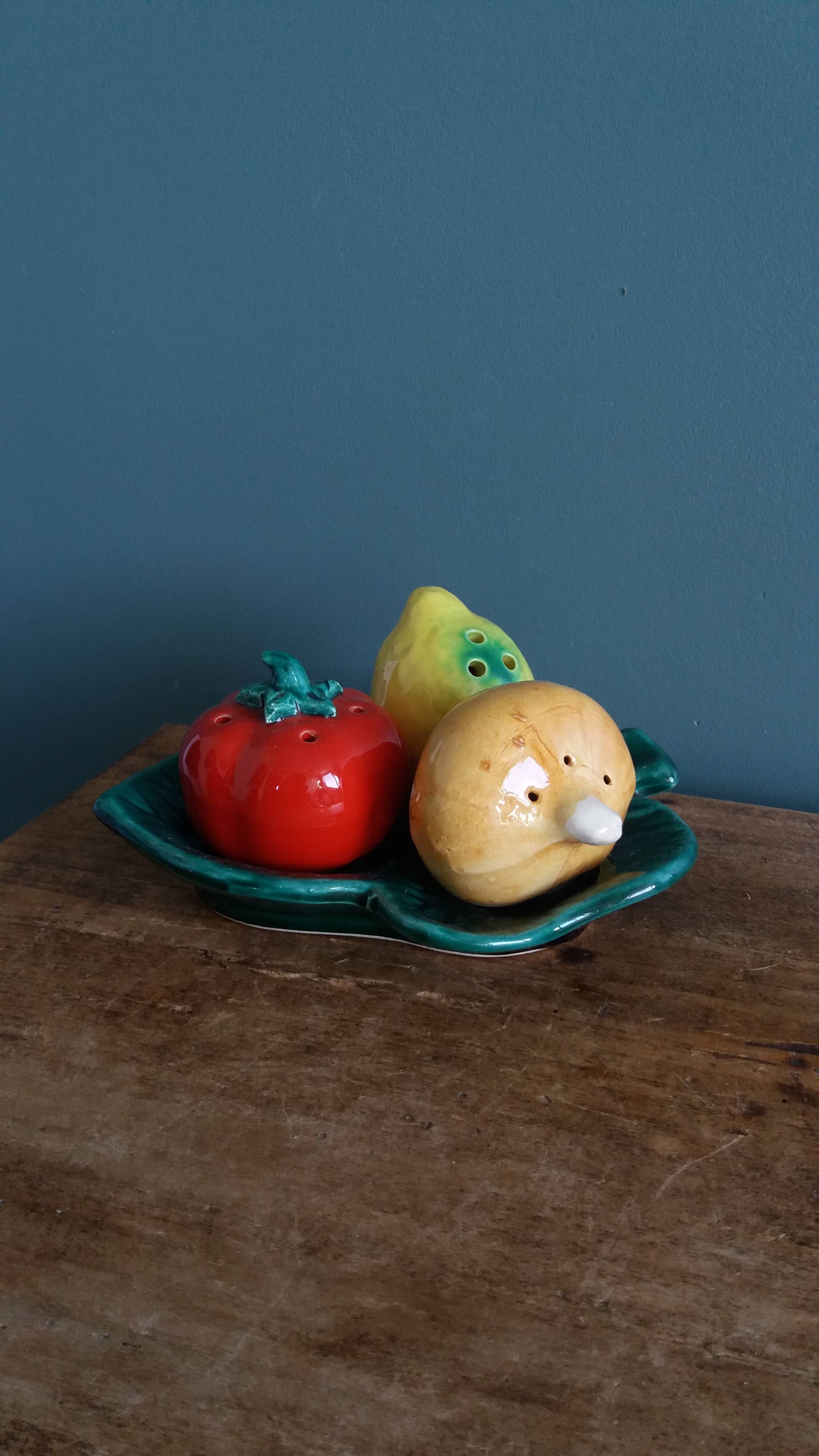 Salt and pepper shaker vegetables on a slipware leaf signed FPP Vallauris.