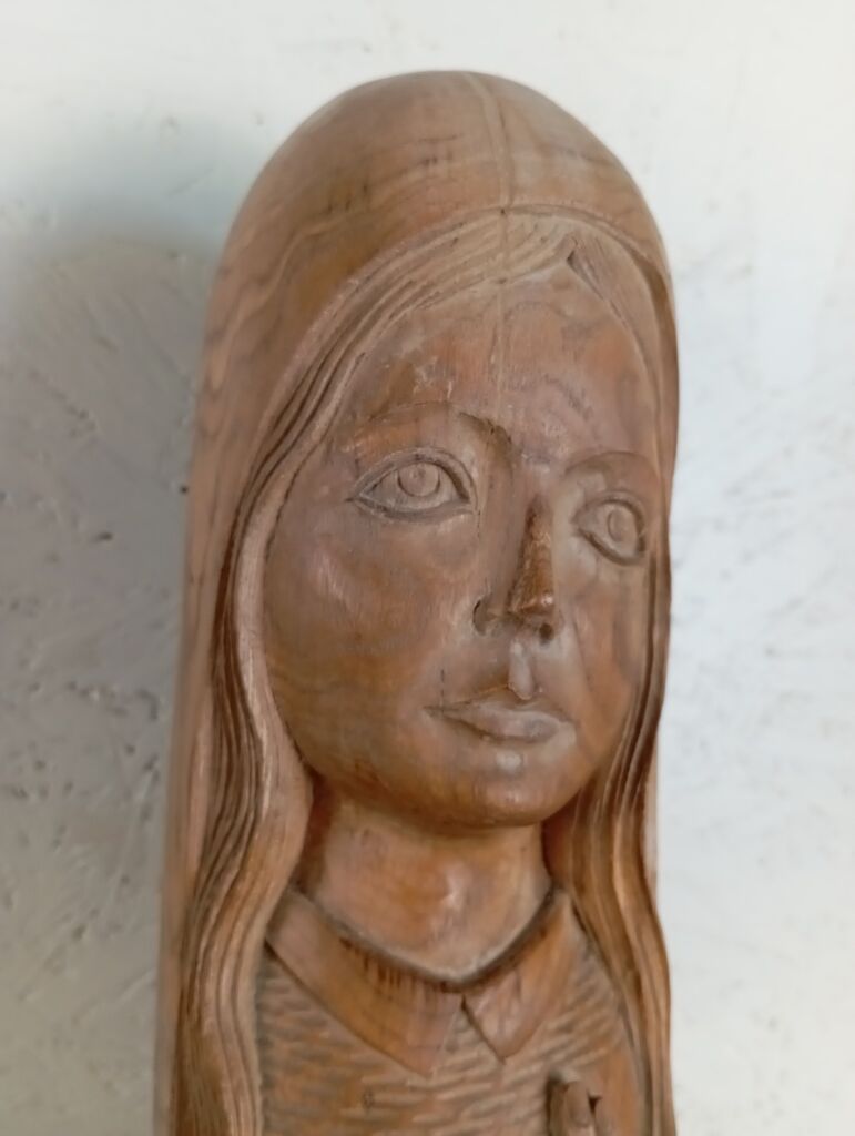 Sculpture of a young woman by Ray Boterf.