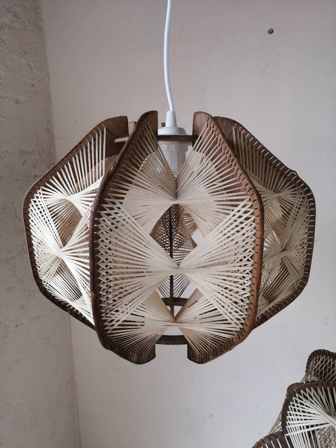 Pair of vintage wooden and rattan straw pendant lights.