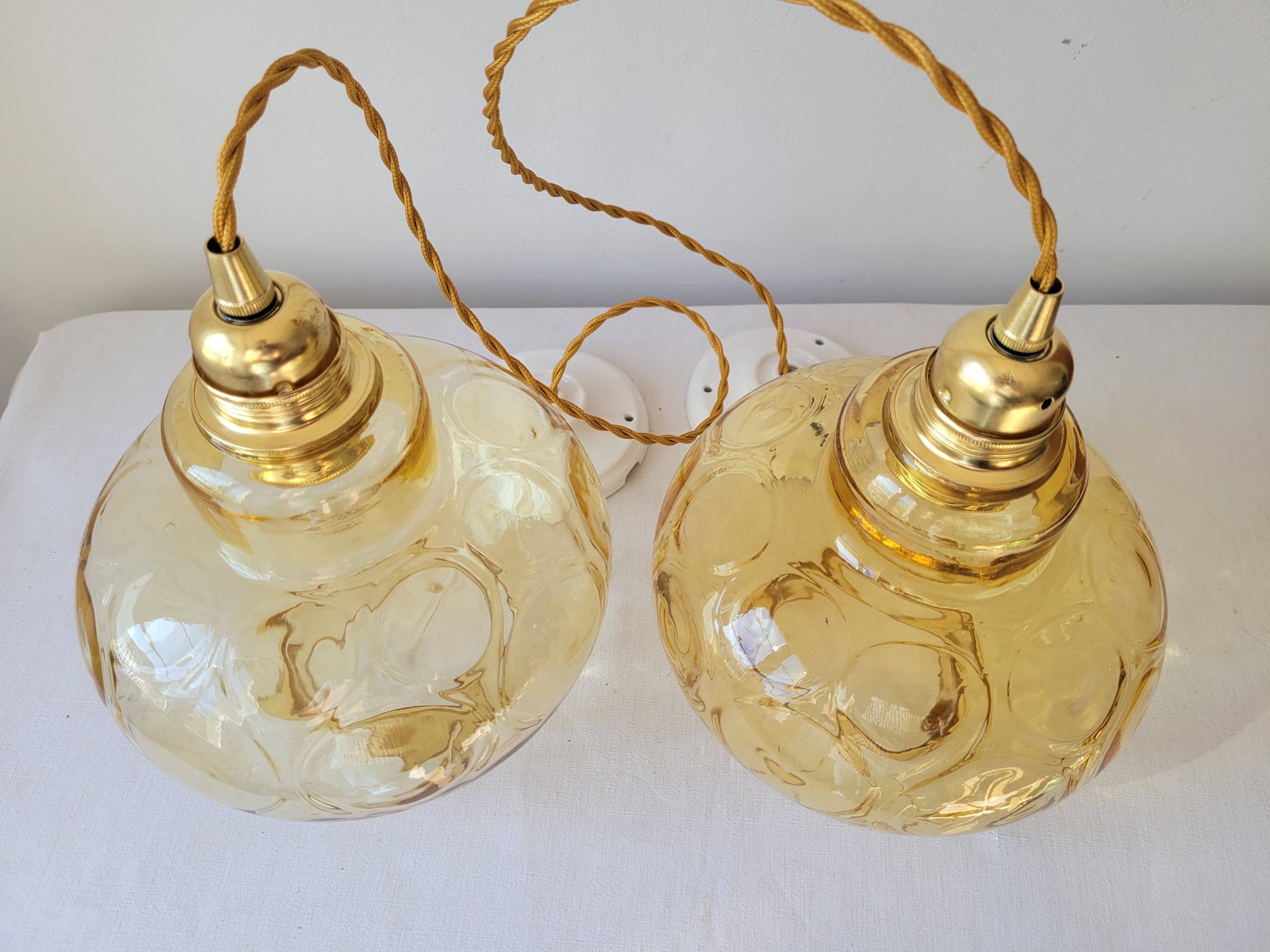 Duo of amber glass pendant lights