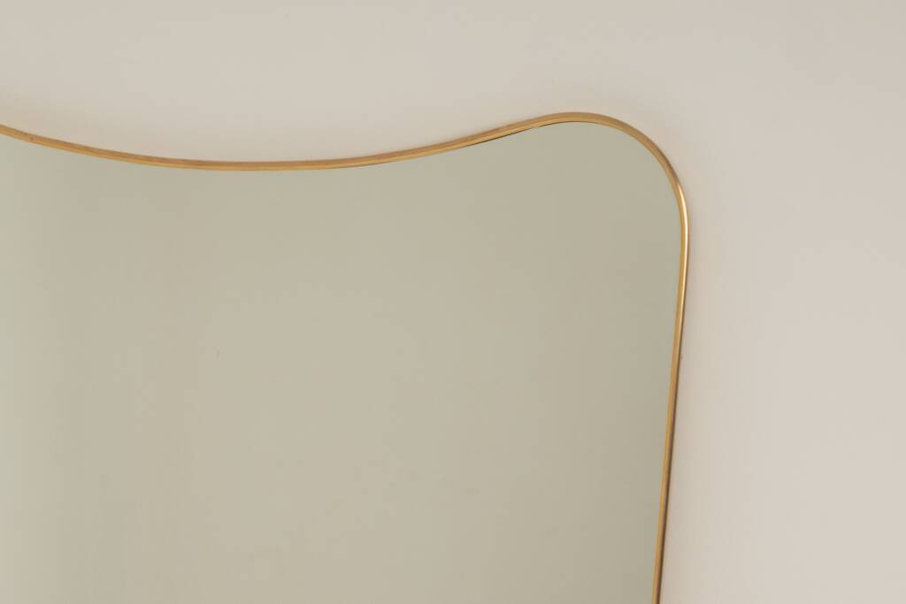 Patinated brass-framed mirror. 1980s/90s.