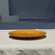 Antique oval dish, yellow-orange, frieze border L:24