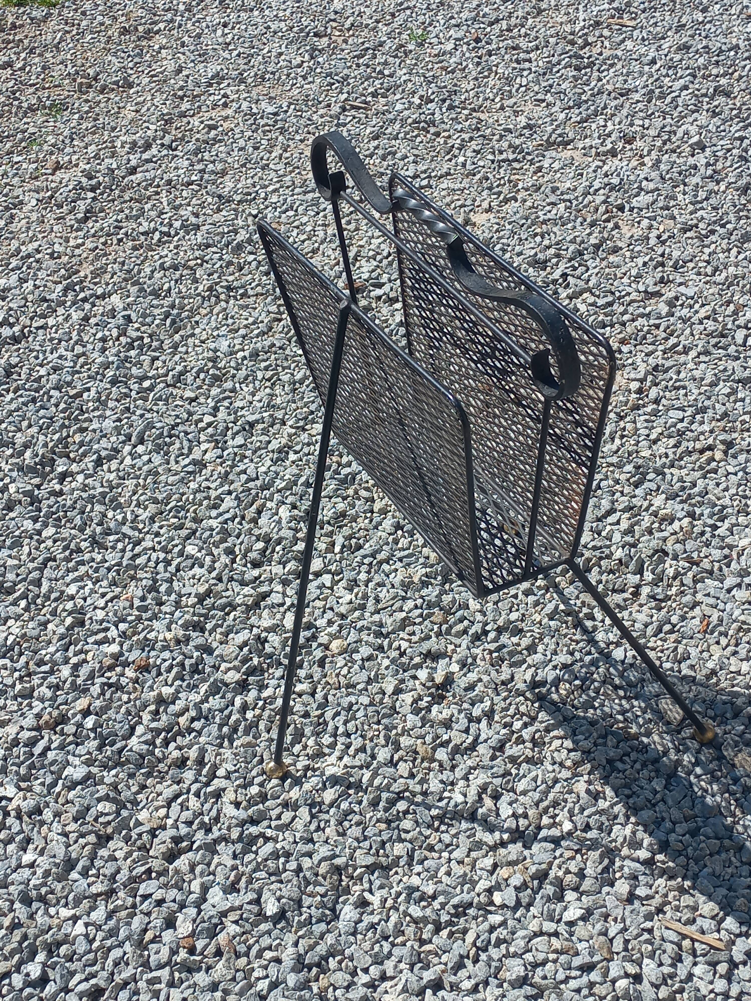 Perforated metal magazine rack from the 1960s.