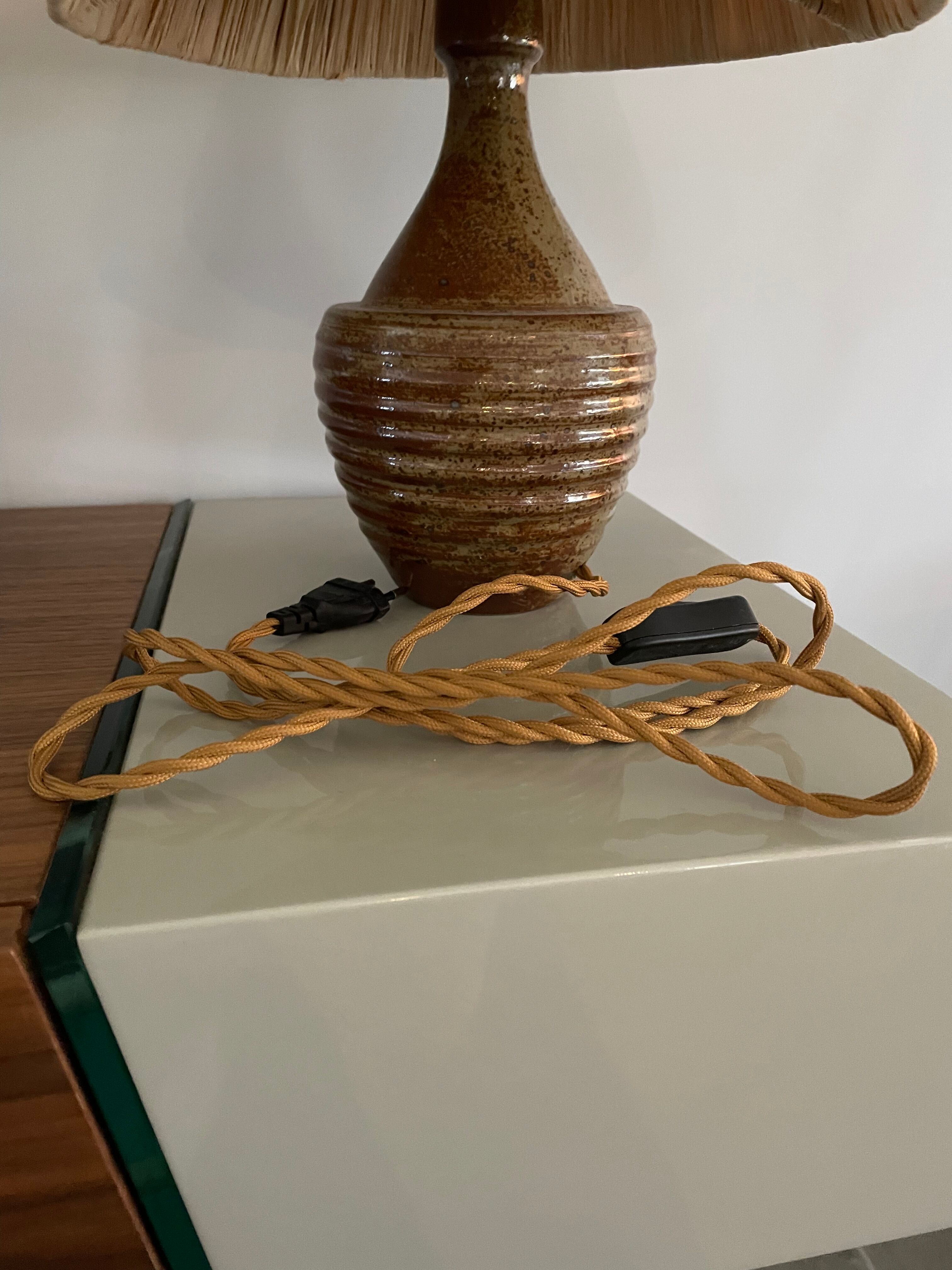 Sandstone lamp and raffia