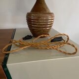 Sandstone lamp and raffia