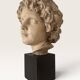Plaster bust on a wooden base
