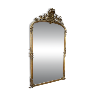 Napoleon III mirror in wood and gilded stucco with gold leaf.