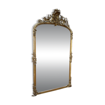 Napoleon III mirror in wood and gilded stucco with gold leaf.