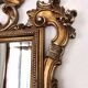 Large Italian mirror in carved wood, traditional gilding, 1980s.