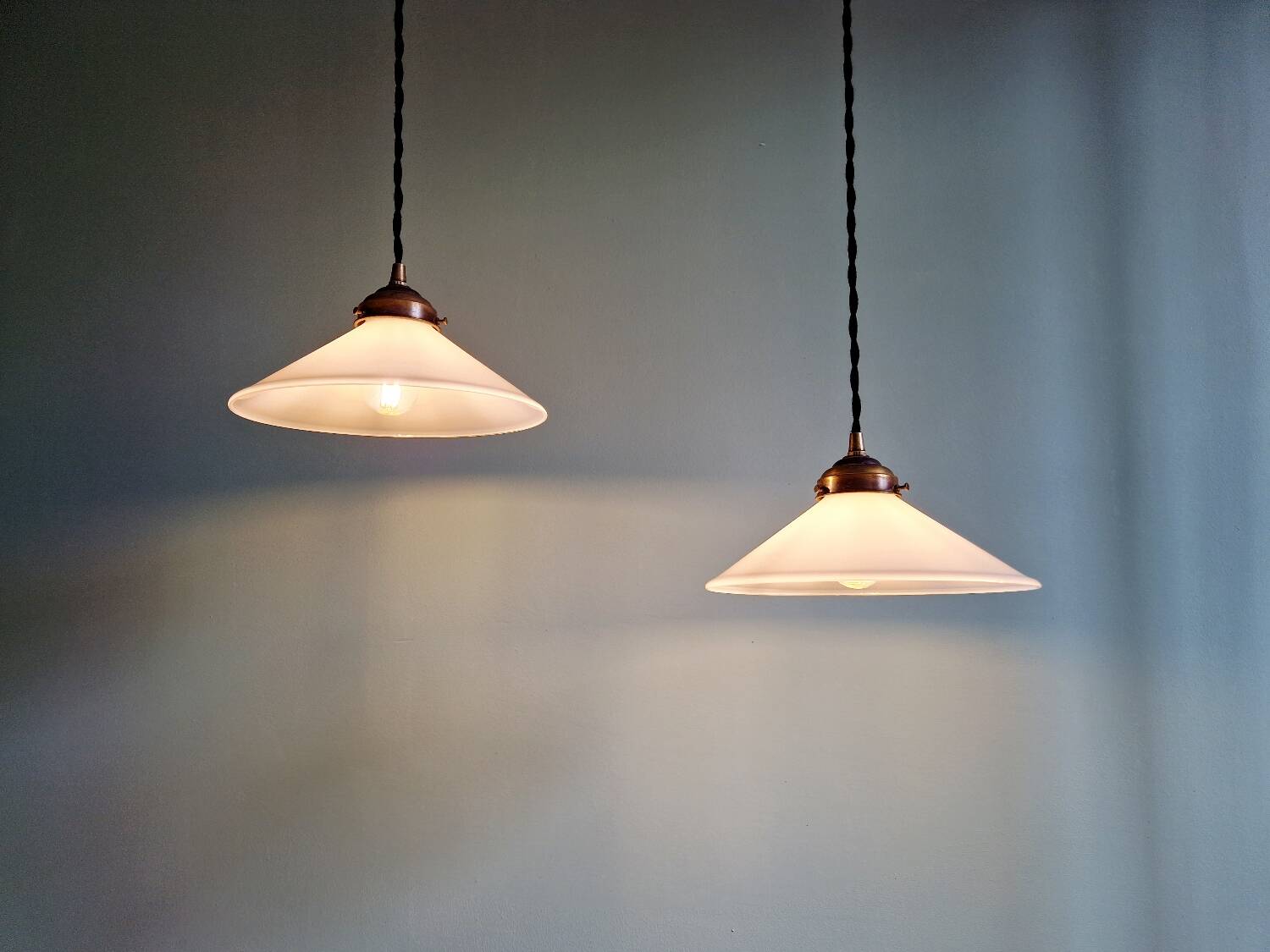 Pair of Art Deco conical white opaline pendants, 1920-30.