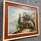 Italian School: painting of a castle on the edge of a lake