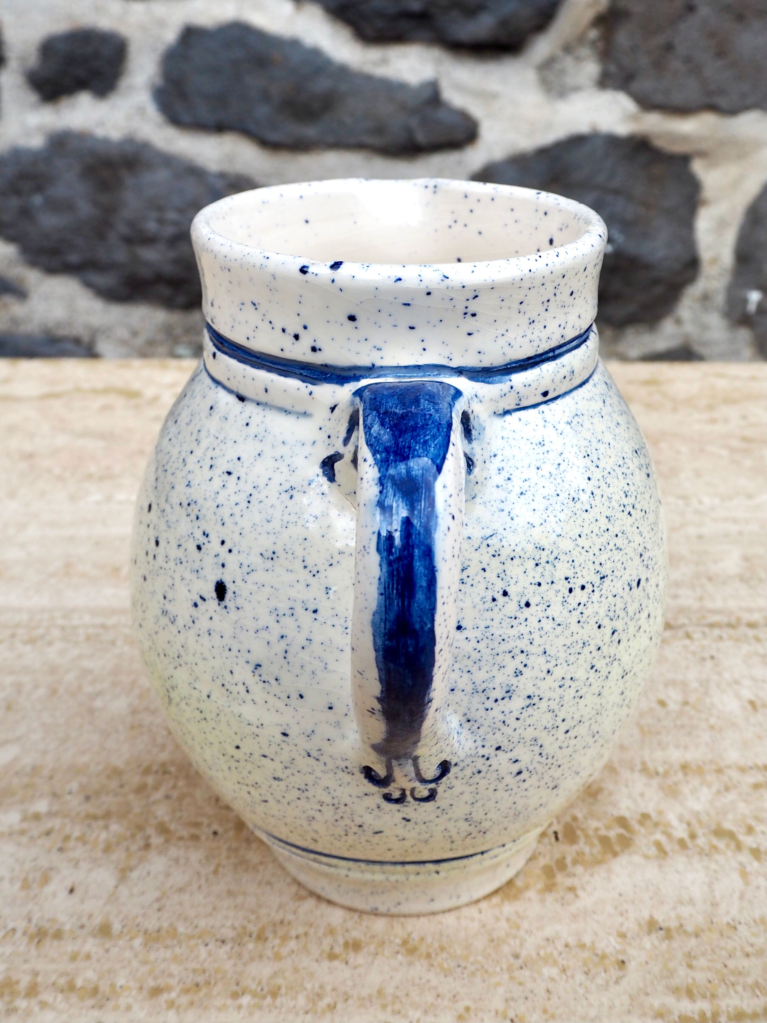 Speckled ceramic pitcher