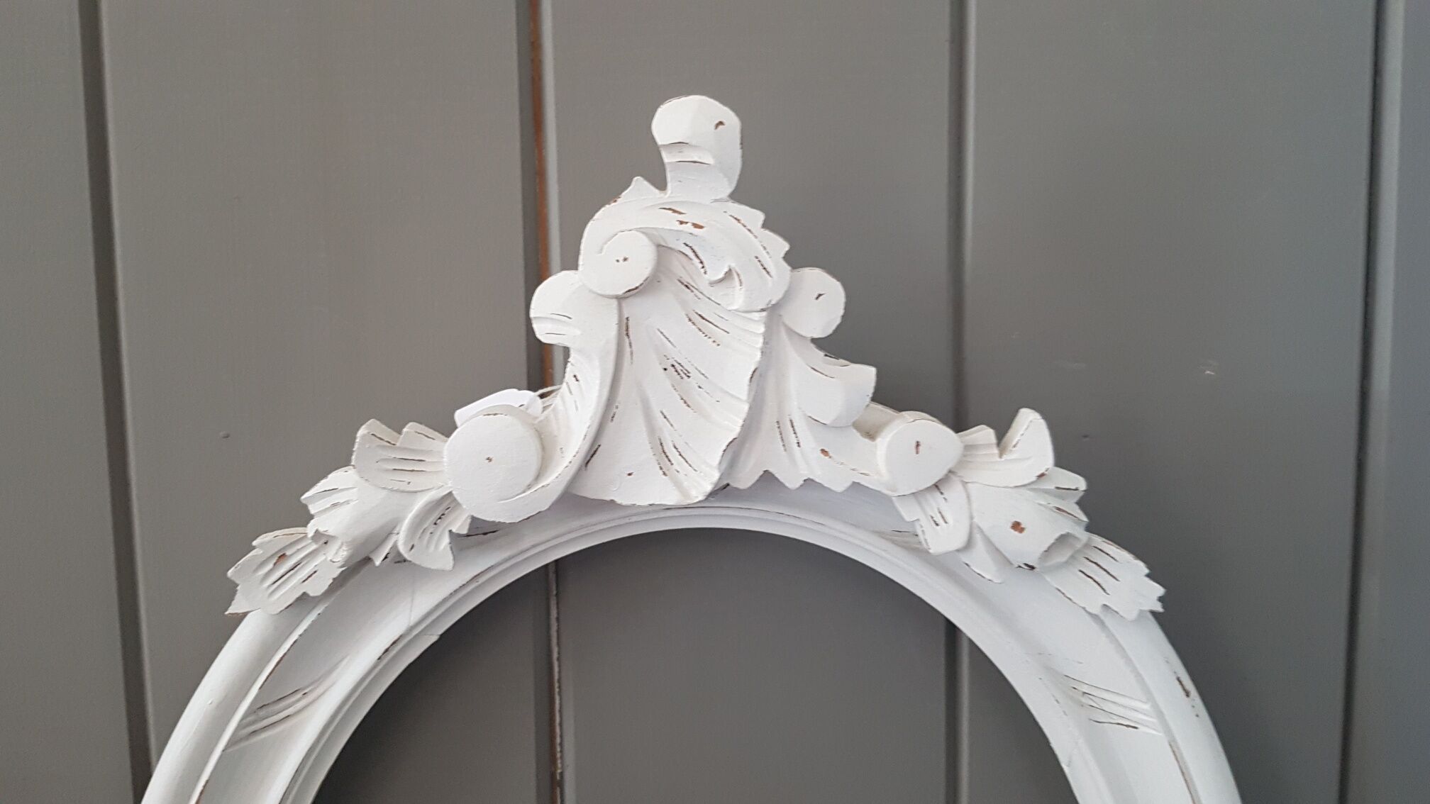 Old oval frame patinated white