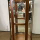Wooden display case and half-moon mirror