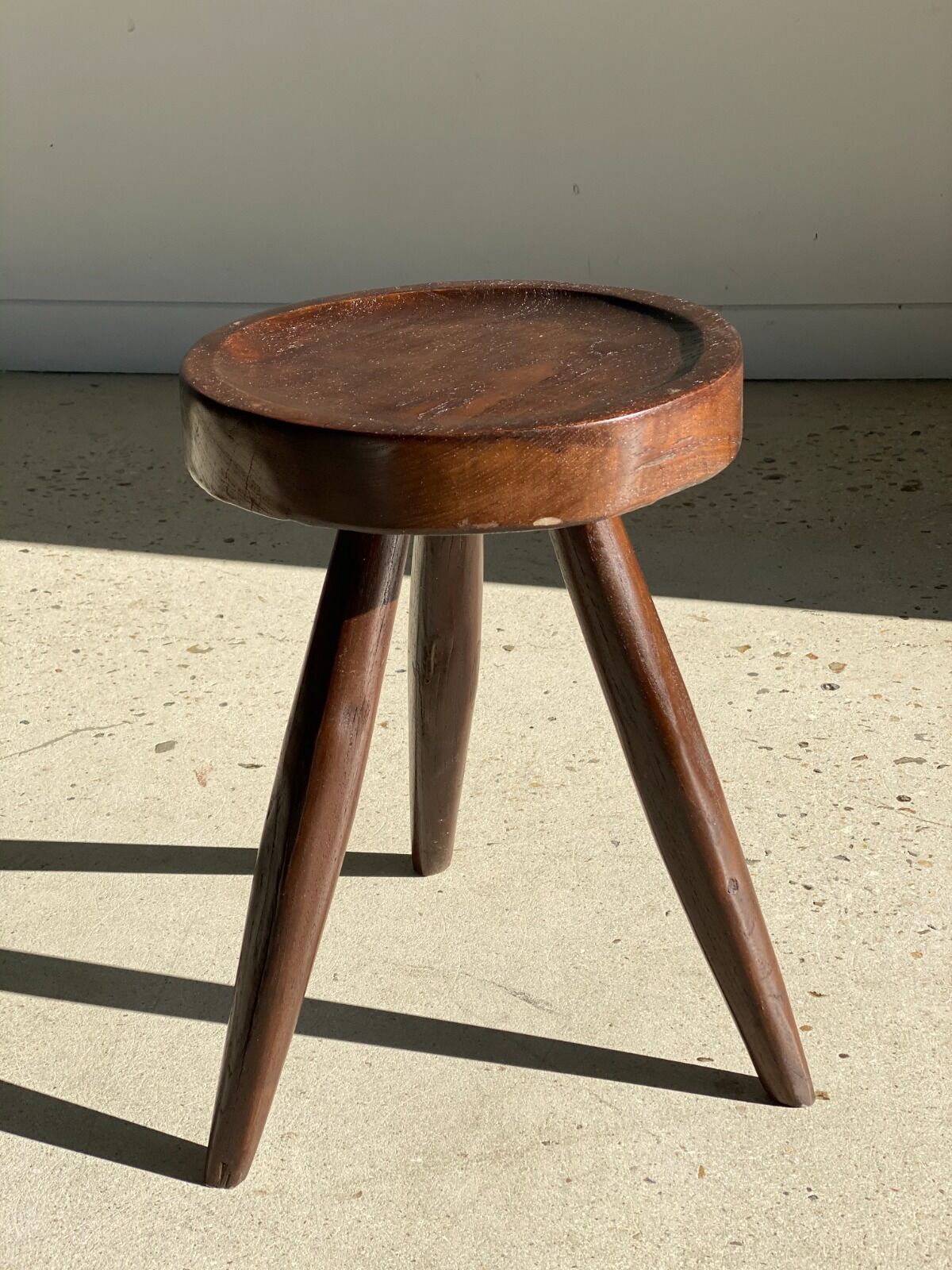 Brown solid wood stool seated circular dug