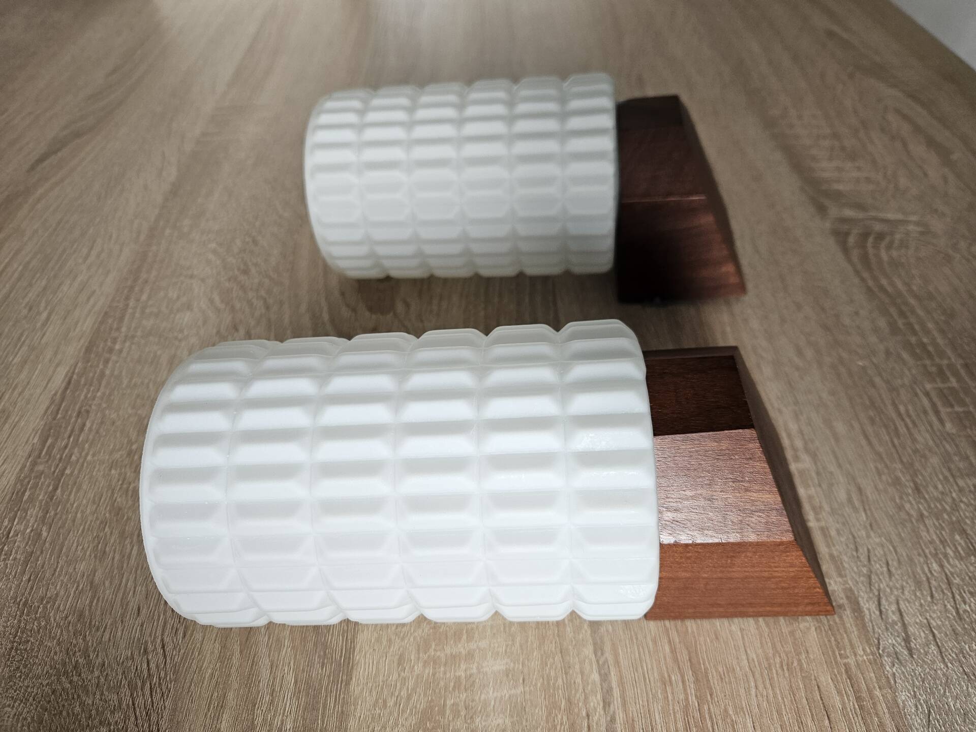 Philips wall sconces in wood and white opal.