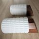Philips wall sconces in wood and white opal.