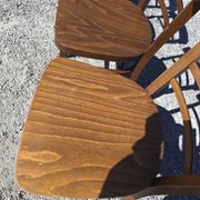 7 curved wooden bistro chairs by Baumann