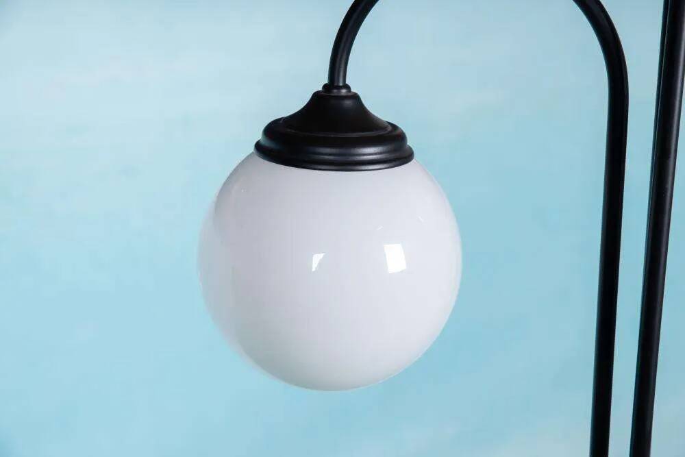 Minimalist floor lamp in glass, space age style.