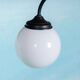Minimalist floor lamp in glass, space age style.