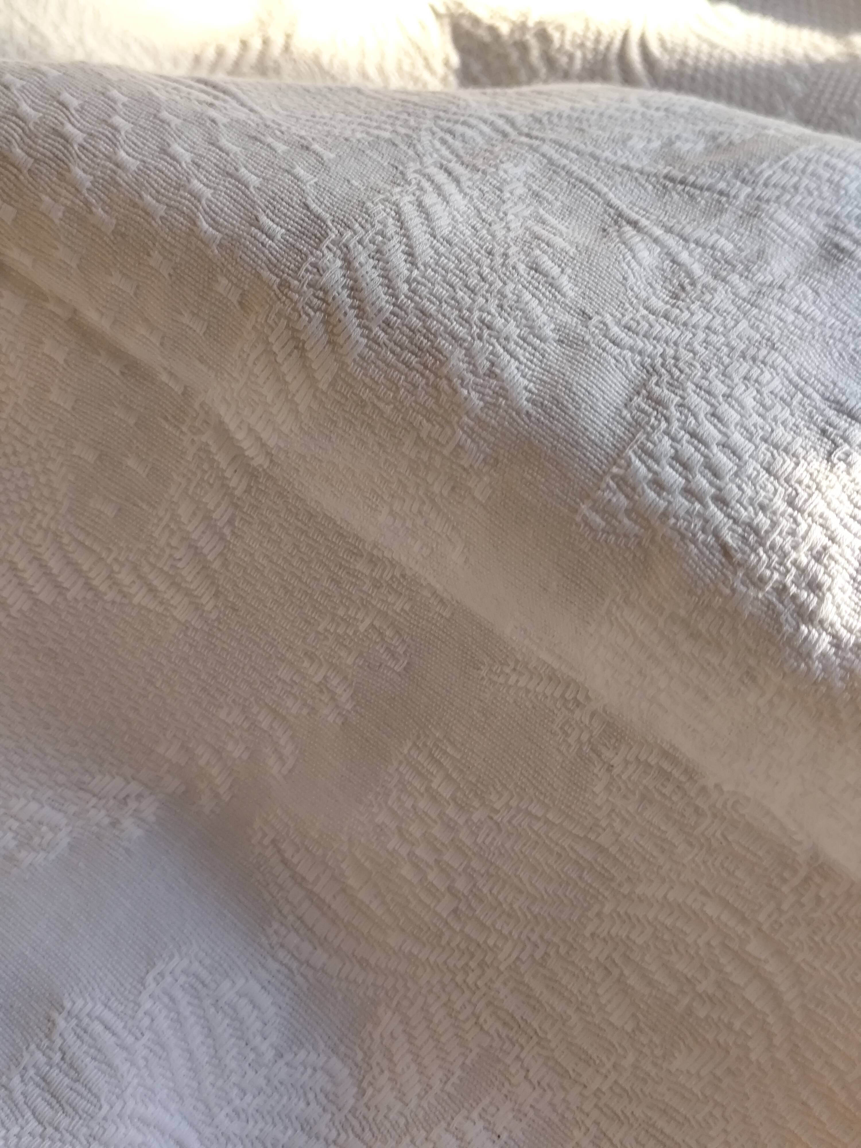 White woven cotton bedspread with fringes