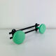 Wall-mounted coat rack with 2 green hooks from the 1950s.
