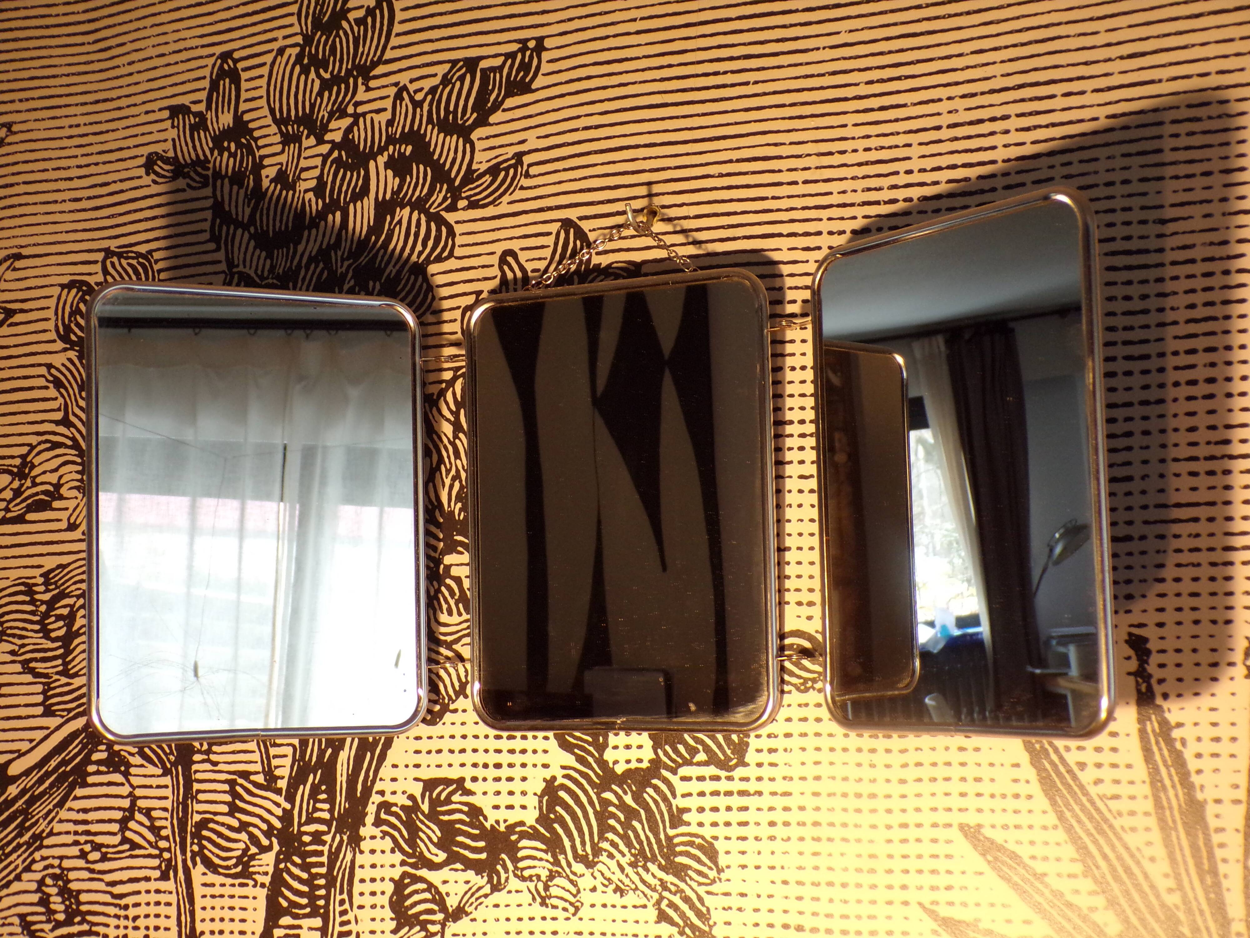 Triptych mirror with chain.